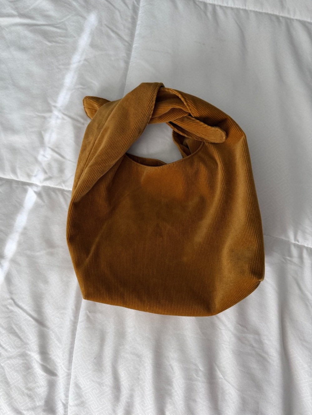 Merit Corduroy Knot makeup bag